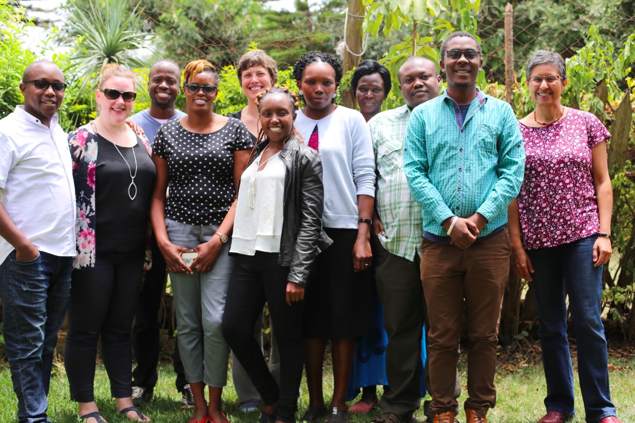 AfID volunteer with hosts in Kenya